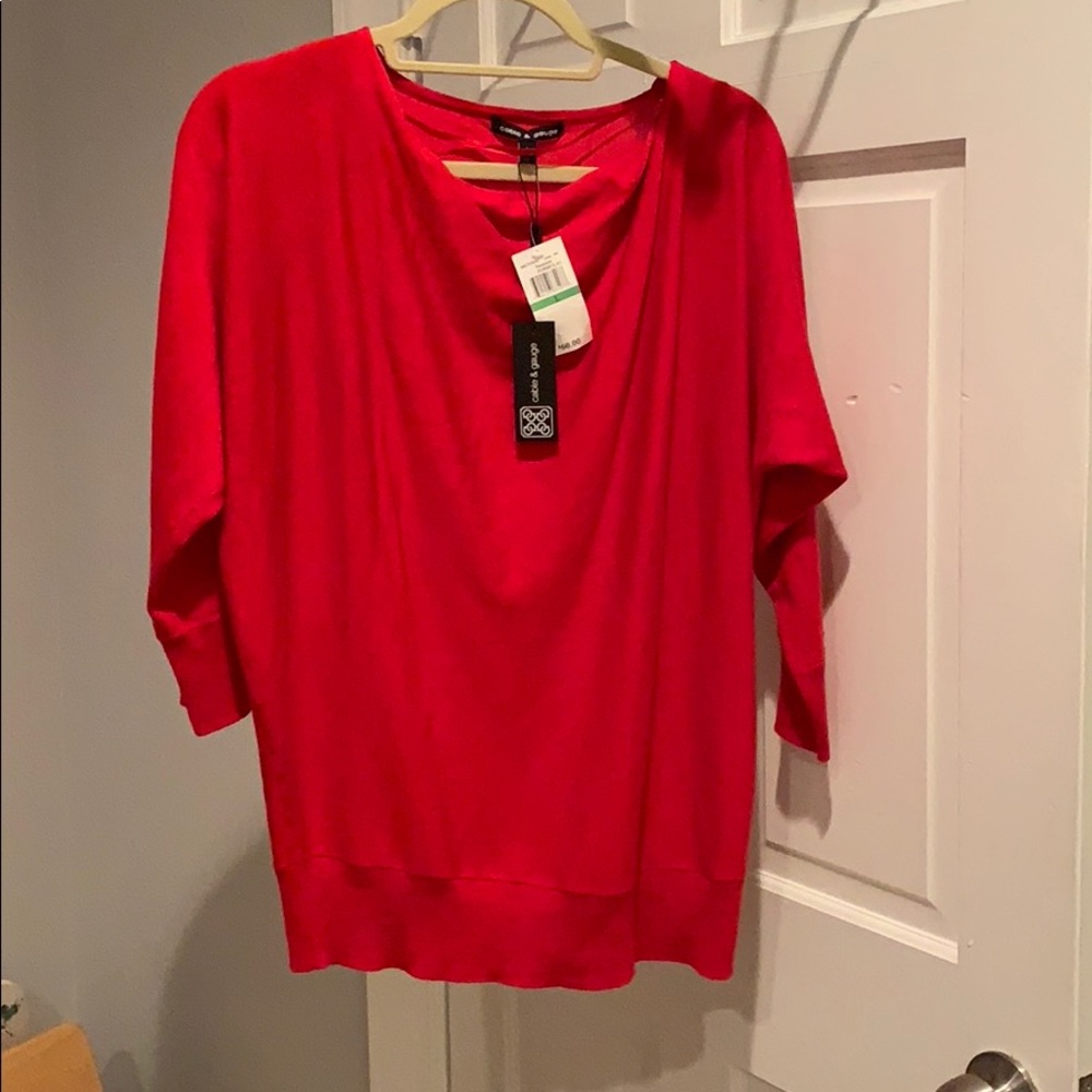 Red scoop neck sweater.